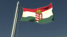 a red white and green flag with a coat of arms on it