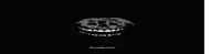 a black and white image of a skeleton with a smiley face on a black background .