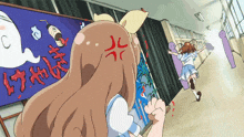 a girl with an angry expression on her face stands in front of a sign that says " c "