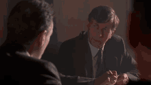a man in a suit and tie is talking to another man with the words what 's the matter written in yellow