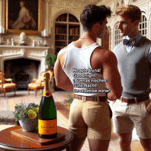 a bottle of veuve clicquot champagne sits on a table next to two men