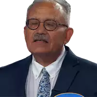 a man in a suit and tie with his eyes closed and his mouth open