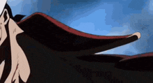 a close up of a person 's face with wings flying in the wind .