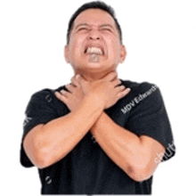 a man is holding his throat with his hands while making a funny face .