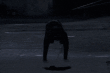 the moon is shining brightly over a dark street