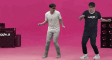two men are dancing in front of a sign that says ' ggle.ai '