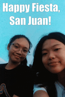 two girls are posing for a picture with the words happy fiesta san juan behind them