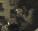 a man is smoking a cigar and holding a lighter in his hand