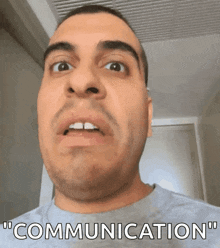 a close up of a man 's face with the words " communication " below him
