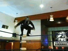a pro wrestling ring with a sign that says pwc