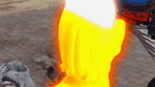 a person is standing on a brick sidewalk with a yellow flame coming out of their leg