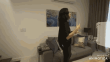 a woman standing in a living room with the words made in animotica on the bottom right