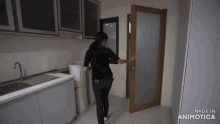 a woman opens a door in a kitchen that is made in animotica