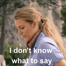 a woman with a scarf around her neck and the words i don 't know what to say