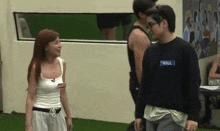 a man and a woman are standing next to each other and the woman has a name tag that says will