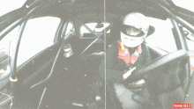 a person wearing a helmet is sitting in a car with thinkjules written on the bottom of the screen