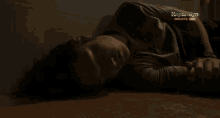 a man is laying on the floor with the words kapamilya online live behind him