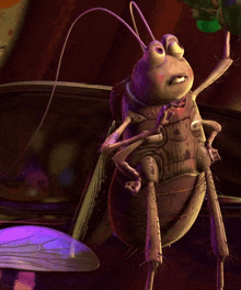 a cartoon grasshopper is sitting on a table