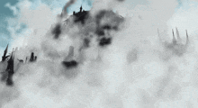 a castle is surrounded by clouds and smoke coming out of it