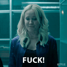 a woman in a blue jacket says " fuck "