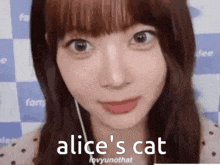 a close up of a woman 's face with the words `` alice 's cat '' written on the bottom .