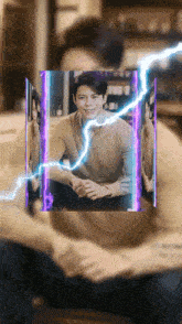 a man in a brown sweater is surrounded by purple lightning bolts