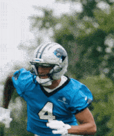 a football player wearing a blue jersey with the number 4
