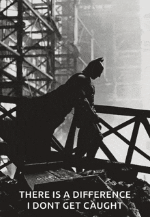 a black and white photo of batman with the caption " there is a difference i don t get caught "
