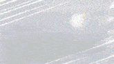 a blurred image of two balls flying through the air .