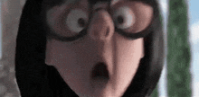 a close up of a cartoon character wearing glasses and a surprised look on her face .
