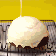 a cake covered in white frosting is on a cooling rack with easy pie written on the bottom