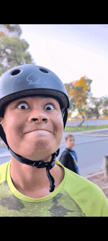 a person wearing a helmet with the number 3 on it making a funny face