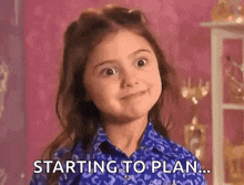 a little girl in a blue shirt is smiling and saying `` starting to plan ... '' .