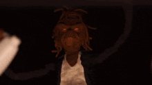 a blurred image of a person 's face with a brown background .