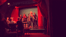 a blurred image of a group of people on a stage