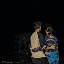 a man and a woman are hugging each other in the dark and the photo was taken by mw asher_miu
