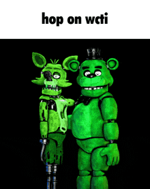 two green stuffed animals are standing next to each other with the caption hop on wcii