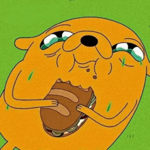a cartoon dog is eating a sandwich with tears coming out of his eyes .