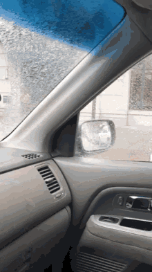 a car with a blue windshield and a door handle