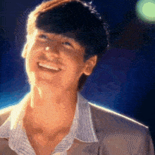 a close up of a man 's face with the sun shining on it