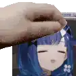 a person is petting a blue haired anime girl 's head with their hand .