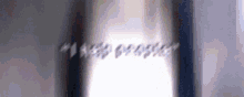 a blurry picture of a person standing in front of a window with the words `` i love you '' written on it