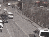 a white van is parked on the side of a busy street
