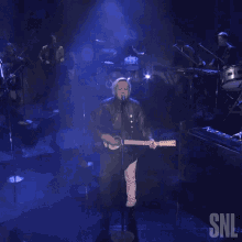 playing guitar arcade fire saturday night live the lightning song strumming