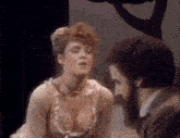 a man and a woman are talking to each other