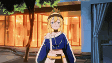 a girl with blonde hair and a blue shirt with a x on it