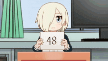 a girl holding a sign that says 48 on it