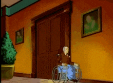 a man in a wheelchair is standing in front of a door in a hallway
