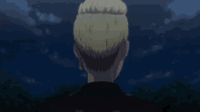a man wearing glasses and a black jacket looks at the sky