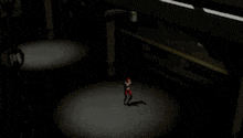 a person is standing in a dark room with a flashlight .
